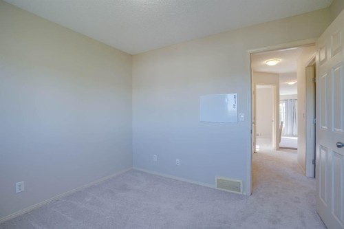 15 Tuscany Reserve Bay Nw, Calgary, AB - Indoor Photo Showing Other Room