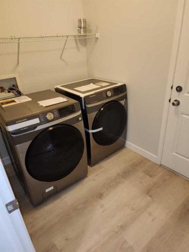 15 Tuscany Reserve Bay Nw, Calgary, AB - Indoor Photo Showing Laundry Room
