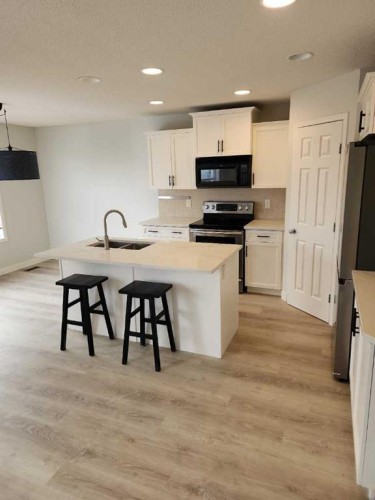 15 Tuscany Reserve Bay Nw, Calgary, AB - Indoor Photo Showing Kitchen With Stainless Steel Kitchen With Double Sink