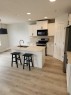 15 Tuscany Reserve Bay Nw, Calgary, AB  - Indoor Photo Showing Kitchen With Stainless Steel Kitchen With Double Sink 
