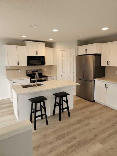 15 Tuscany Reserve Bay Nw, Calgary, AB - Indoor Photo Showing Kitchen With Double Sink