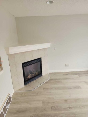 15 Tuscany Reserve Bay Nw, Calgary, AB - Indoor Photo Showing Living Room With Fireplace