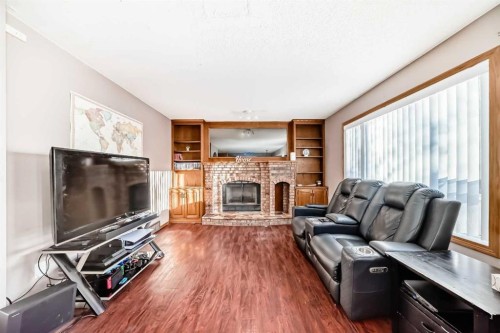78 Sandringham Way Nw, Calgary, AB - Indoor Photo Showing Living Room With Fireplace