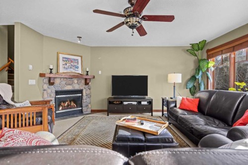 318-170 Crossbow Place, Canmore, AB - Indoor Photo Showing Living Room With Fireplace