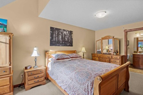 318-170 Crossbow Place, Canmore, AB - Indoor Photo Showing Bedroom