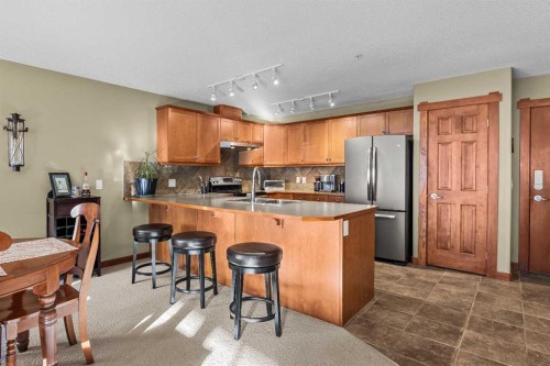 318-170 Crossbow Place, Canmore, AB - Indoor Photo Showing Kitchen With Double Sink