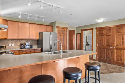 318-170 Crossbow Place, Canmore, AB - Indoor Photo Showing Kitchen With Double Sink