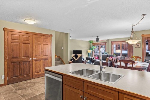 318-170 Crossbow Place, Canmore, AB - Indoor Photo Showing Kitchen With Double Sink