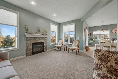 1718 High Park Drive Nw, High River, AB - Indoor Photo Showing Living Room With Fireplace