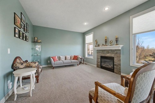 1718 High Park Drive Nw, High River, AB - Indoor Photo Showing Living Room With Fireplace