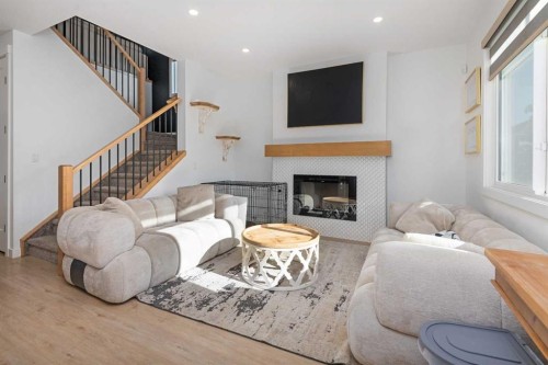 1071 Stevens Place, Crossfield, AB - Indoor Photo Showing Living Room With Fireplace