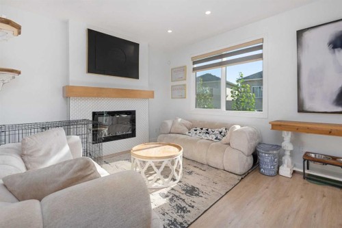 1071 Stevens Place, Crossfield, AB - Indoor Photo Showing Living Room With Fireplace