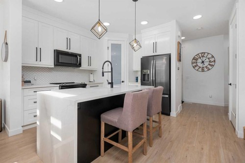 1071 Stevens Place, Crossfield, AB - Indoor Photo Showing Kitchen With Upgraded Kitchen