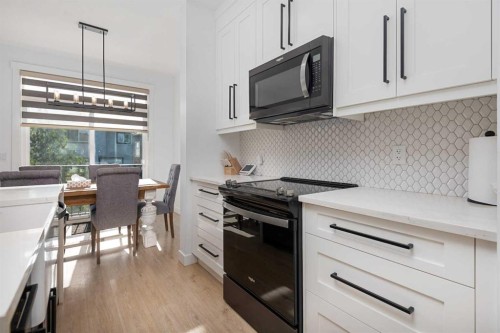 1071 Stevens Place, Crossfield, AB - Indoor Photo Showing Kitchen With Upgraded Kitchen