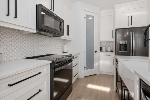 1071 Stevens Place, Crossfield, AB - Indoor Photo Showing Kitchen With Upgraded Kitchen