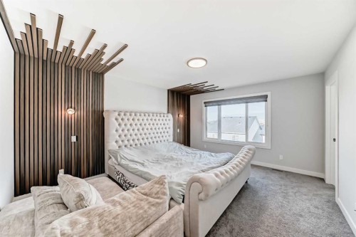 69 Amblehurst Way Nw, Calgary, AB - Indoor Photo Showing Bedroom