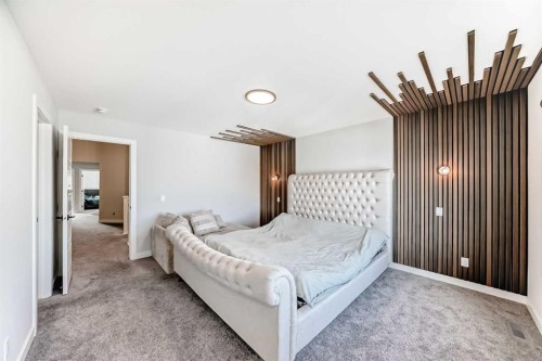 69 Amblehurst Way Nw, Calgary, AB - Indoor Photo Showing Bedroom