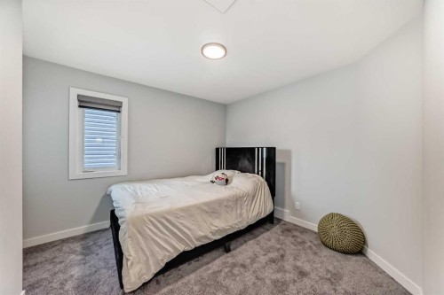 69 Amblehurst Way Nw, Calgary, AB - Indoor Photo Showing Bedroom
