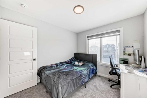 69 Amblehurst Way Nw, Calgary, AB - Indoor Photo Showing Bedroom