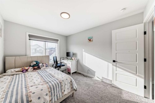 69 Amblehurst Way Nw, Calgary, AB - Indoor Photo Showing Bedroom