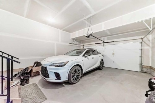 69 Amblehurst Way Nw, Calgary, AB - Indoor Photo Showing Garage