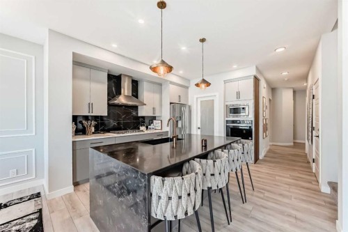 69 Amblehurst Way Nw, Calgary, AB - Indoor Photo Showing Kitchen With Upgraded Kitchen