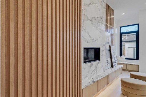 2008 8 Avenue Se, Calgary, AB - Indoor Photo Showing Other Room With Fireplace