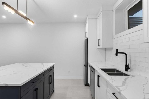 95 South Shore Road, Chestermere, AB - Indoor Photo Showing Kitchen With Double Sink With Upgraded Kitchen