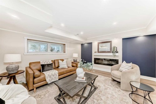 1 Spruce Bank Crescent Sw, Calgary, AB - Indoor Photo Showing Living Room With Fireplace