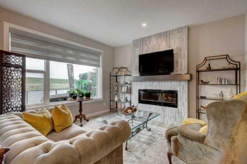 144 Cranbrook Gardens West, Calgary, AB - Indoor Photo Showing Living Room With Fireplace