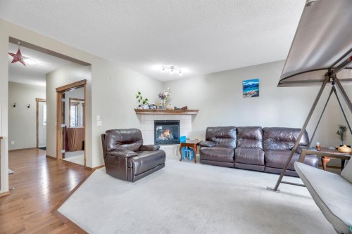 98 Pantego Road Nw, Calgary, AB - Indoor Photo Showing Living Room With Fireplace