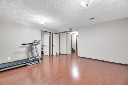 98 Pantego Road Nw, Calgary, AB - Indoor Photo Showing Gym Room