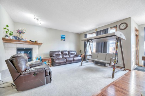 98 Pantego Road Nw, Calgary, AB - Indoor Photo Showing Living Room With Fireplace