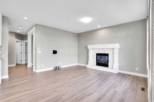 179 Panatella Cape Nw, Calgary, AB - Indoor Photo Showing Living Room With Fireplace