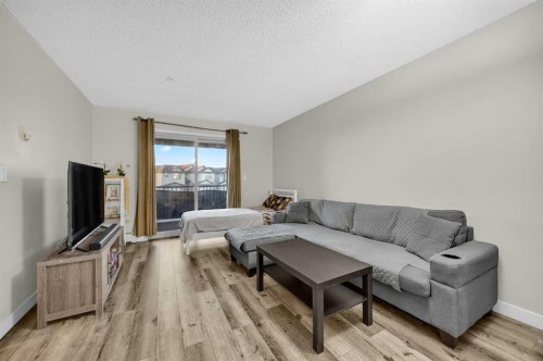 207-5 Saddlestone Way Ne, Calgary, AB - Indoor Photo Showing Living Room