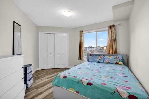 207-5 Saddlestone Way Ne, Calgary, AB - Indoor Photo Showing Bedroom