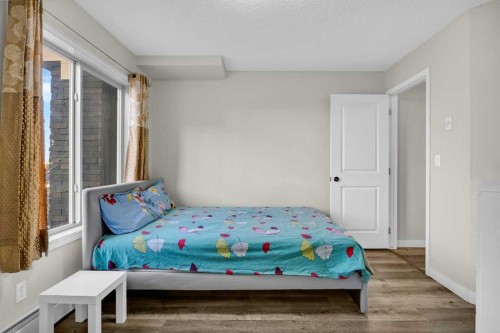 207-5 Saddlestone Way Ne, Calgary, AB - Indoor Photo Showing Bedroom