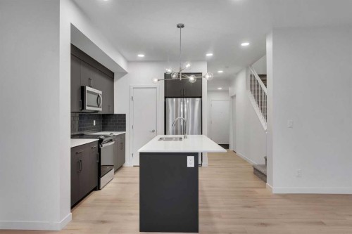 35 Heritage Heath, Cochrane, AB - Indoor Photo Showing Kitchen With Double Sink With Upgraded Kitchen