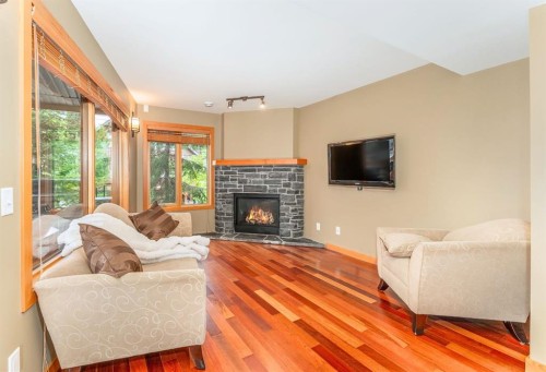 2-722 3Rd Street, Canmore, AB - Indoor Photo Showing Living Room With Fireplace