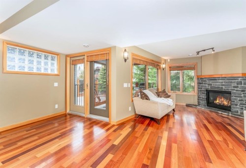 2-722 3Rd Street, Canmore, AB - Indoor Photo Showing Living Room With Fireplace