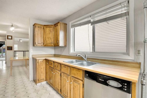 7915 Ranchview Drive Nw, Calgary, AB - Indoor Photo Showing Kitchen With Double Sink