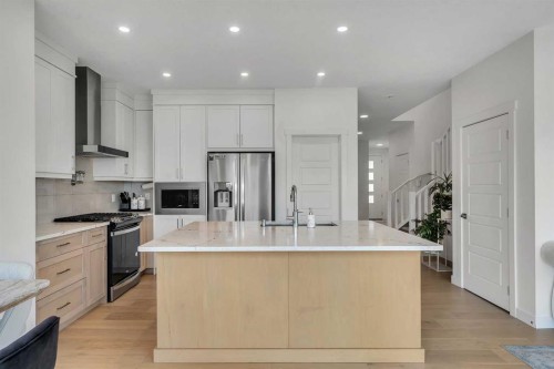 172 Precedence Hill, Cochrane, AB - Indoor Photo Showing Kitchen With Upgraded Kitchen