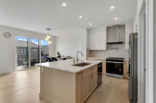 172 Precedence Hill, Cochrane, AB - Indoor Photo Showing Kitchen With Double Sink With Upgraded Kitchen