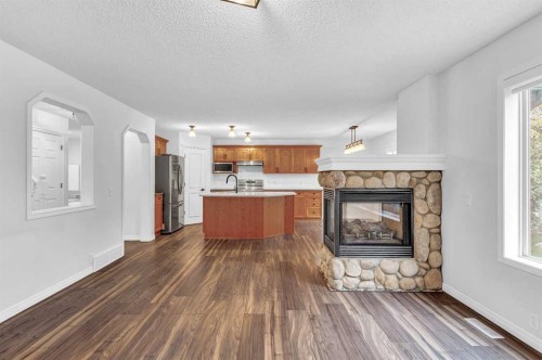 331 Springbank Place Sw, Calgary, AB - Indoor Photo Showing Living Room With Fireplace