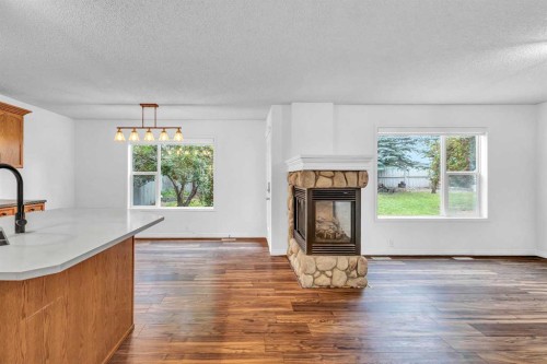 331 Springbank Place Sw, Calgary, AB - Indoor Photo Showing Other Room With Fireplace