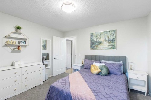 206 Mt Aberdeen Manor Se, Calgary, AB - Indoor Photo Showing Bedroom