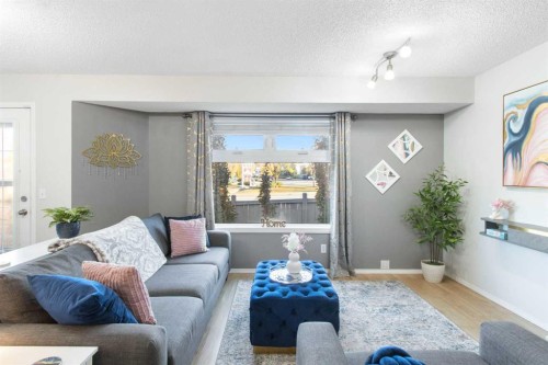 206 Mt Aberdeen Manor Se, Calgary, AB - Indoor Photo Showing Living Room