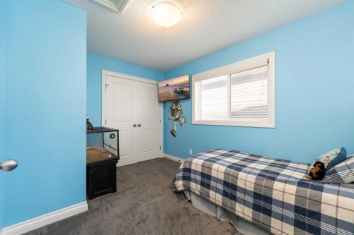 719 Hampton Hills Drive Ne, High River, AB - Indoor Photo Showing Bedroom