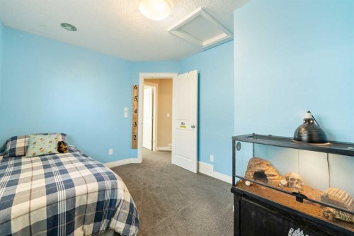 719 Hampton Hills Drive Ne, High River, AB - Indoor Photo Showing Bedroom