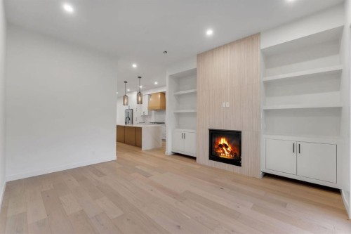 506 28 Avenue Nw, Calgary, AB - Indoor Photo Showing Other Room With Fireplace